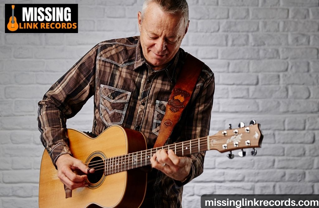 what kind of guitar does tommy emmanuel play