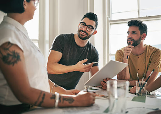 Cropped shot of a team of designers brainstorming together in an office